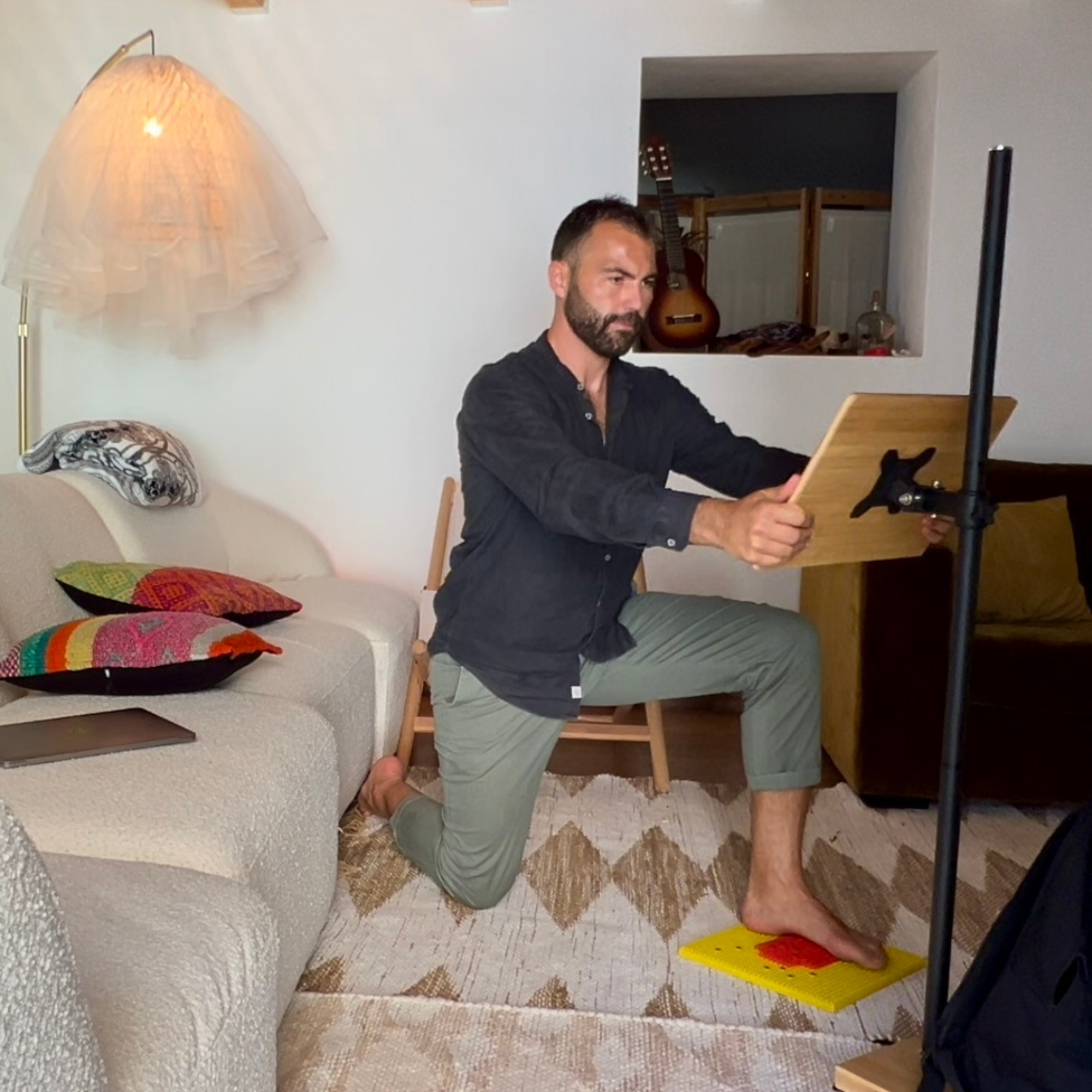 Simone Ripamonti Coach engaged in a demonstration of reading posture yoga for seniors